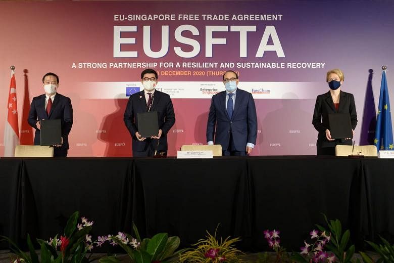 (From left) Enterprise Singapore chief executive Png Cheong Boon, Permanent Secretary for Trade and Industry Gabriel Lim, Minister for Communications and Information S. Iswaran and EU Ambassador to Singapore Barbara Plinkert at the signing of the agr