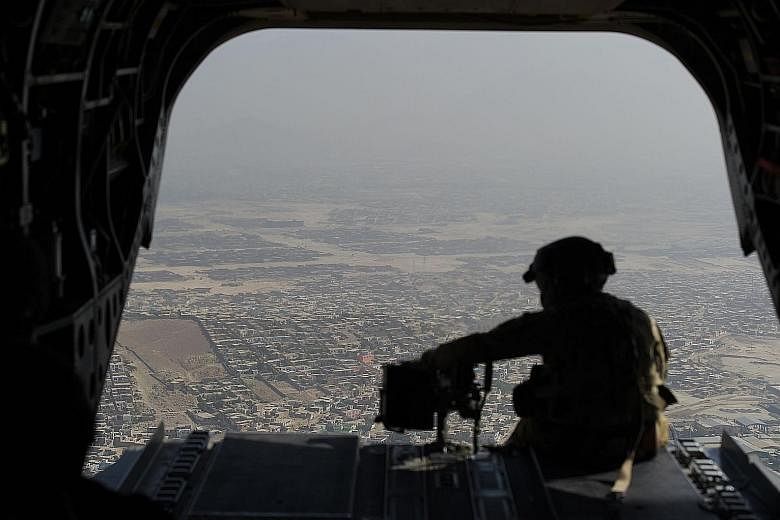 A US Chinook helicopter flying over Kabul in 2017. Beijing may now be enjoying America's withdrawal from Afghanistan, but it is the one that is most likely to feel the longer-term repercussions, says the writer.