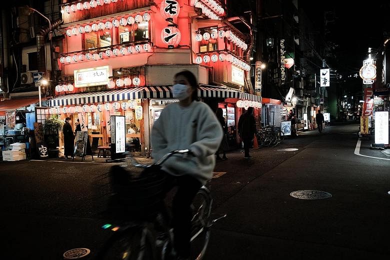 A quiet street in Osaka's Namba entertainment district on Sunday. Osaka Governor Hirofumi Yoshimura declared a "red alert" in his prefecture amid a worsening Covid-19 outbreak.