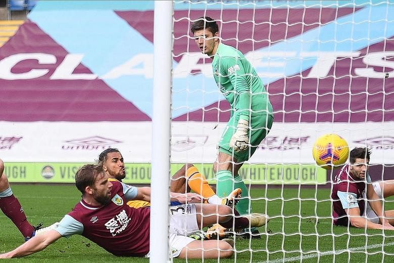 Everton striker Dominic Calvert-Lewin scoring past Burnley goalkeeper Nick Pope during their Premier League match yesterday. The England international has more league goals from inside the box (11) than any other player in Europe's top five divisions