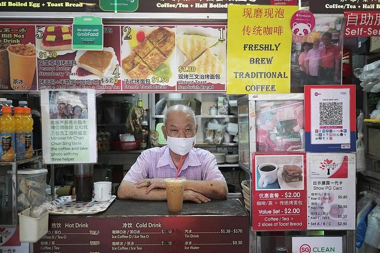 Mr Christopher Lau, owner of Bakes n Bites, with a Nets terminal at his stall in Old Airport Road Food Centre. A recent visit showed that 80 per cent of all the hawkers there use a payment QR code or a Nets terminal. Mr Don Eng, owner of Pasta Manna,