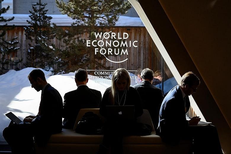 Some delegates at this year's World Economic Forum annual meeting in Davos, Switzerland, in January. The WEF Special Annual Meeting 2021 is set to be held in Singapore next May. It will be only the second time the meeting will take place outside of D