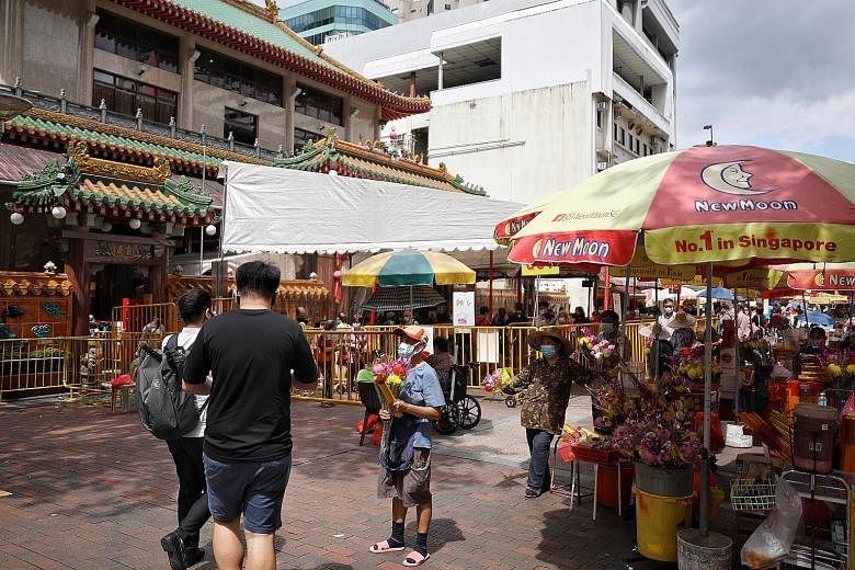 Vendors in front of Kwan Im Thong Hood Cho Temple in Waterloo Street. The requirement for the 41 vendors in the area to move into allocated lots will ensure there is safe distancing and unobstructed fire engine access, and also allow pedestrians more