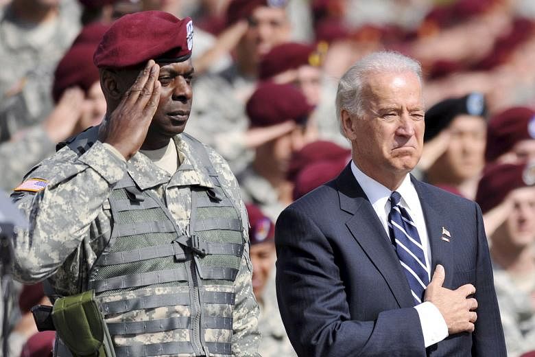 Then US Vice-President Joe Biden with Lieutenant-General Lloyd Austin during a ceremony at Fort Bragg, North Carolina, in 2009. If confirmed, General Austin, who as Central Command head ran military operations in the Middle East under president Barac
