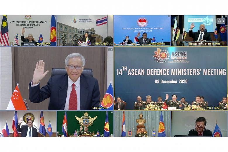 Singapore's Defence Minister Ng Eng Hen with other Asean defence ministers at the virtual 14th Asean Defence Ministers' Meeting yesterday. They exchanged views on the impact of Covid-19 on the region in the past year. PHOTO: MINDEF