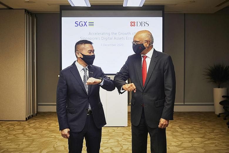 SGX chief executive Loh Boon Chye (left) and DBS chief executive Piyush Gupta. SGX will take a 10 per cent stake in the DBS Digital Exchange. PHOTO: DBS