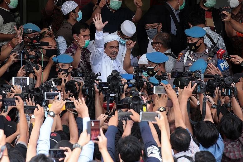 The police yesterday arrested firebrand cleric Rizieq Shihab (above) for allegedly flouting Covid-19 restrictions by holding events that attracted thousands of attendees in Jakarta.