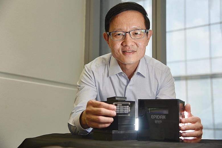 Professor Lim Chwee Teck with the portable polymerase chain reaction kit called Epidax. ST PHOTO: DESMOND WEE