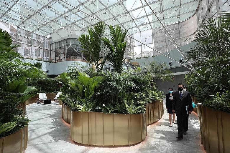 Top: The wealth hub houses more than 30 client advisory rooms, including four pods in a garden-like setting. Above: It also features built-in facilities to host bespoke lifestyle events for clients and investment seminars. Citibank's wealth hub in Or