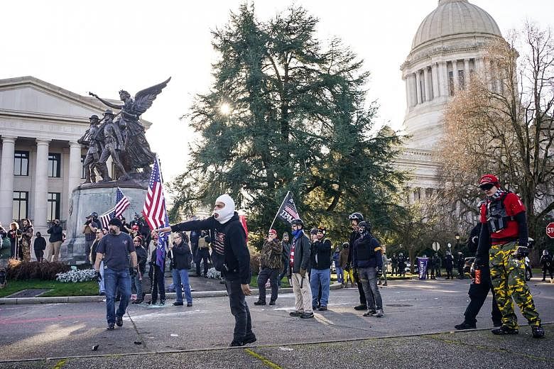 Supporters of United States President Donald Trump gathered at a protest outside the Washington state Capitol in Olympia last Saturday. Up to 82 per cent of Trump supporters polled by CBS News do not see President-elect Joe Biden as the legitimate victor.