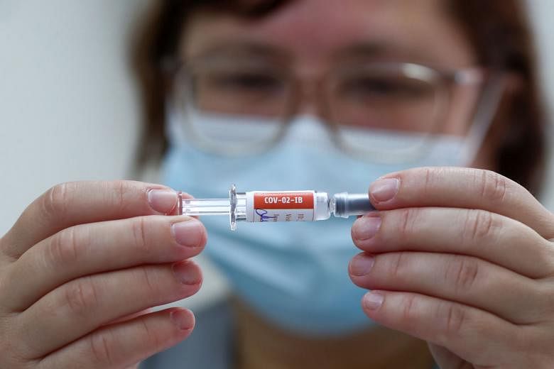 A nurse about to administer Sinovac's CoronaVac vaccine to a trial volunteer at Emilio Ribas Institute in Sao Paulo, Brazil last Friday. PHOTO: REUTERS