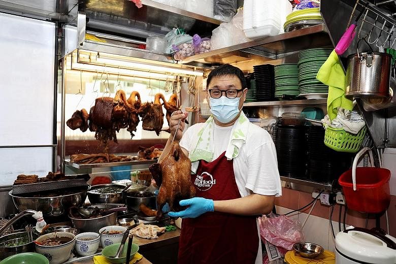 Hawker Melvin Chew of Jin Ji Teochew Braised Duck & Kway Chap at his stall in Chinatown Complex Food Centre. A 24-member international committee has unanimously accepted Singapore's application to have the country's hawker culture added to the Unesco