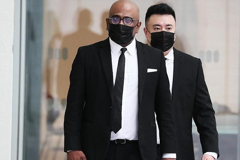 Lawyer M. Ravi arriving at the State Courts yesterday. He was charged with criminal defamation. ST PHOTO: KELVIN CHNG