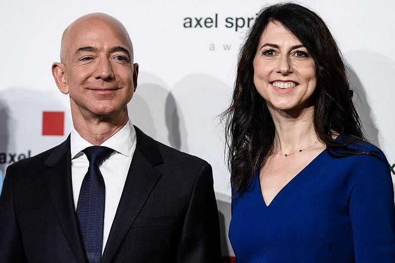 Amazon founder Jeff Bezos and his then-wife MacKenzie Scott in 2018 before their divorce. The two went their separate ways last year. PHOTO: EPA-EFE