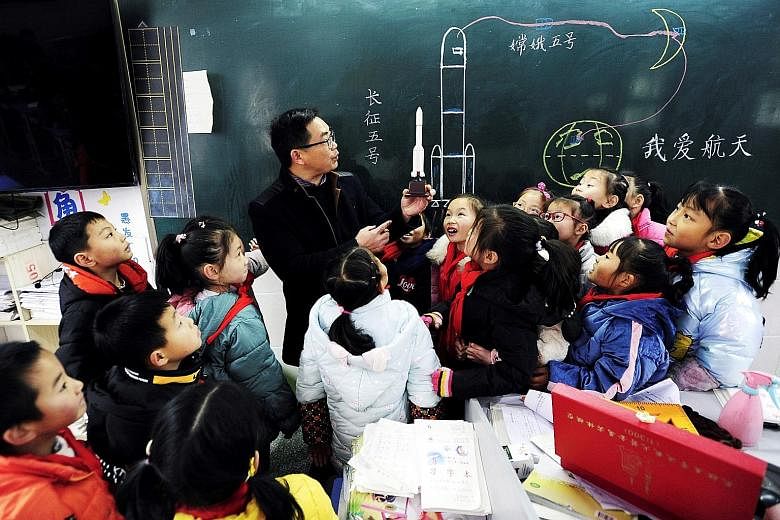 China's Ministry of Education said that during its ongoing curriculum revision launched early last year for compulsory education - first grade to ninth - it decided to include coding in IT courses. PHOTO: AGENCE FRANCE-PRESSE