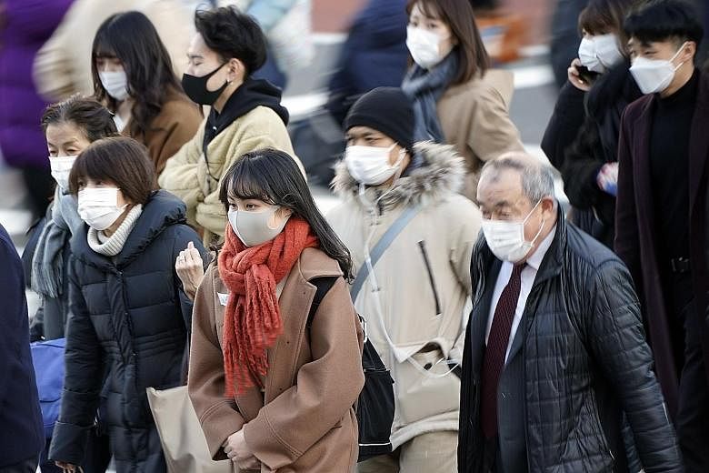 Tokyo raised its Covid-19 alert level to the highest of four stages on Thursday as the number of new cases spiked to a record daily high of 822.