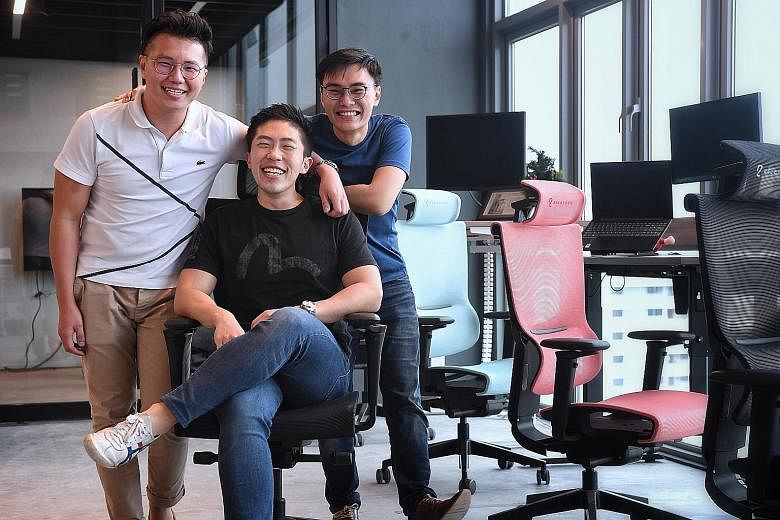 (From far left) TAN JUN KIAT, 30, JOSHUA CHAN, 29, AND LYE YI HAO, 29 Founders of ergonomic office furniture firm Ergo Edge