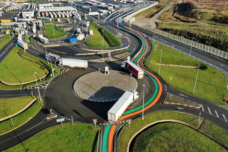 Orange and green lanes - part of new Customs infrastructure in the event of a no-deal Brexit - marked out for entry into France and the EU at the Eurotunnel terminal in Coquelles, France, on Friday. Talks to reach a trade deal are still ongoing betwe