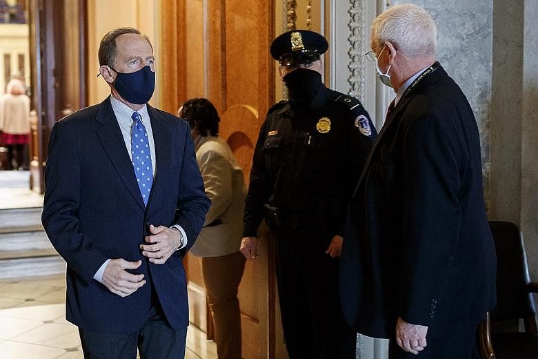 Republican Senator Patrick J. Toomey leaving the Senate on Saturday after a nomination vote at the US Capitol Building in Washington. With time running out for a compromise on the stimulus package, Mr Toomey has agreed to narrow his efforts to rein i