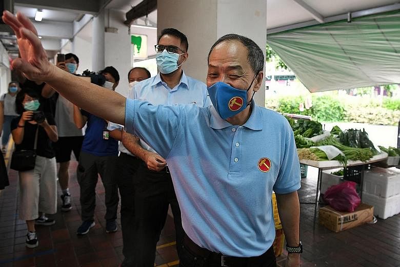 Former Workers' Party chief Low Thia Khiang joining the WP team contesting in Aljunied GRC, led by WP secretary-general Pritam Singh (behind Mr Low), at Hougang Mall on the last day of campaigning on July 8. Former Nee Soon GRC PAP MP Lee Bee Wah tea