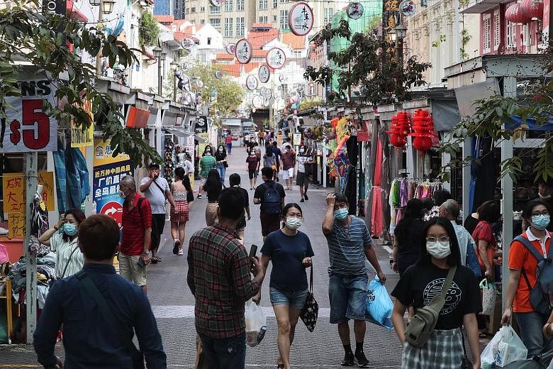 Shoppers in Pagoda Street in Chinatown earlier this month. Singapore Business Federation chief executive Ho Meng Kit said the uncertain business climate continues to weigh on the confidence of small and medium-sized enterprises.