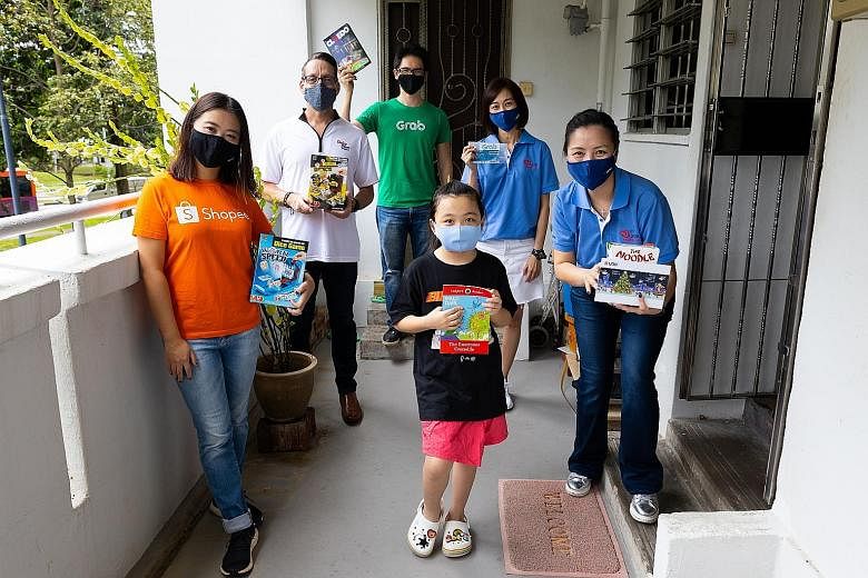 UOB's initiative collected $121,000, with key partners Dairy Farm Singapore, Grab and Shopee also helping to deliver gift boxes to beneficiaries. PHOTO: UOB