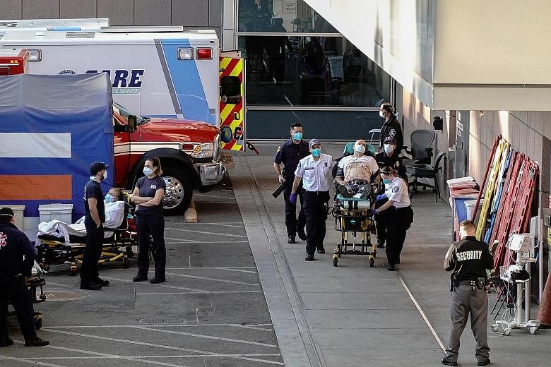 Paramedics escorting a patient to the hospital emergency room in Los Angeles on Sunday, as the United States added one million new Covid-19 cases in just six days, according to figures from Johns Hopkins University.