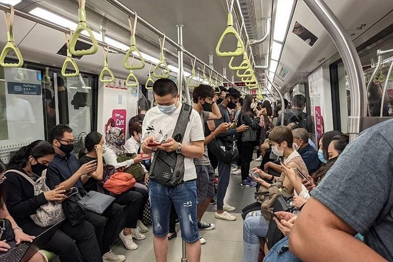 Commuters on board a Downtown Line train at MacPherson MRT station during the service disruption yesterday. The disruption was the second major signalling fault along an MRT line this month.