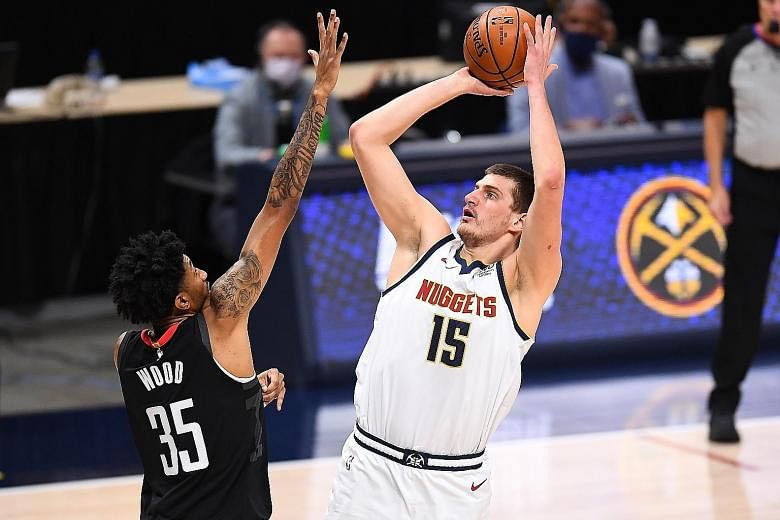 Denver Nuggets centre Nikola Jokic shooting during the 124-111 NBA win over the Rockets on Monday. He finished with a 19-point triple-double.