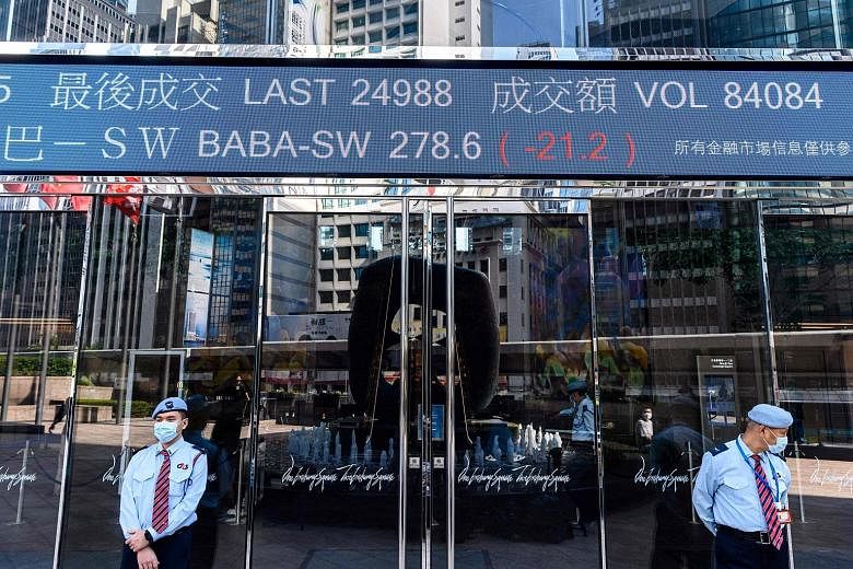 Mr Charles Li, dubbed "Mr China" for linking Hong Kong's bourse closer to the mainland and helping open doors for foreign investors, is deemed a tough act to follow. PHOTO: BLOOMBERG An entrance to Exchange Square, which houses Hong Kong's stock exch