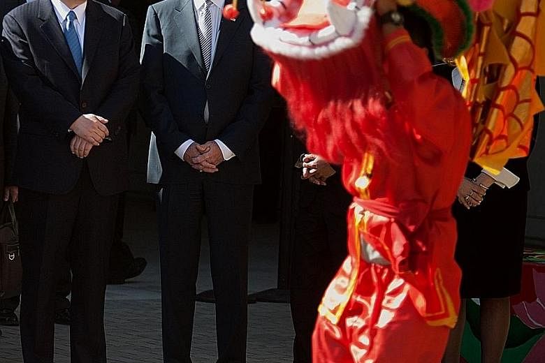 With his vast experience, US President-elect Joe Biden comes better prepared for office than almost any other American president in a century. PHOTO: REUTERS Mr Xi Jinping and Mr Joe Biden watching a dragon dance at the International Studies Learning