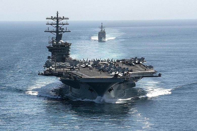The aircraft carrier USS Nimitz and the guided-missile cruiser USS Philippine Sea in formation during a Strait of Hormuz transit in September.