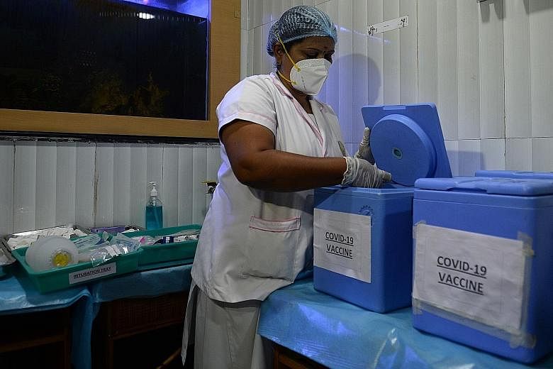 A health official preparing a vaccine kit as she took part in a dry run for Covid-19 vaccine delivery at a primary health centre in Chennai on Saturday. PHOTO: AGENCE FRANCE-PRESSE