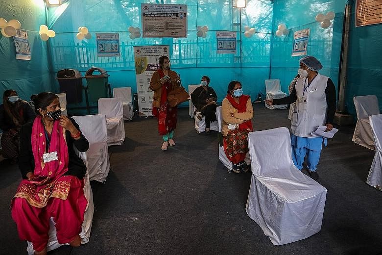 Mock candidates in the waiting area during a dry run for vaccinations at a model Covid-19 vaccination centre in New Delhi on Saturday. India is now expected to start a massive immunisation programme within about a week, a government official said, an