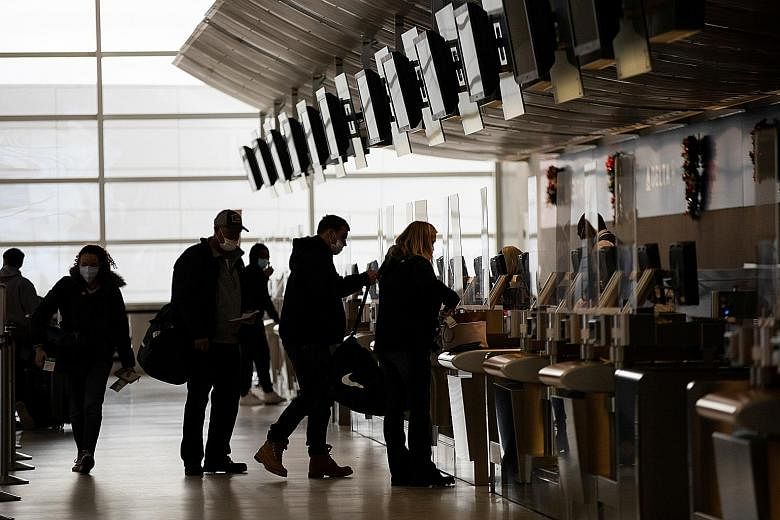 Travellers at an airport in Detroit. DBS' chief investment officer/strategist Hou Wey Fook sees the recent recovery of hotels, resorts and airlines as a sign that market interest is expanding beyond just big tech.