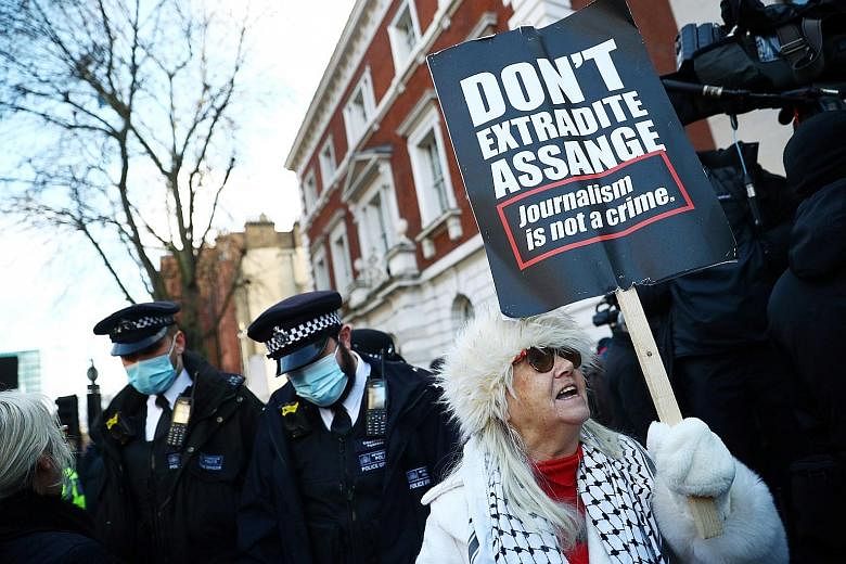 A supporter of Julian Assange outside the Westminster Magistrates Court yesterday. PHOTO: REUTERS