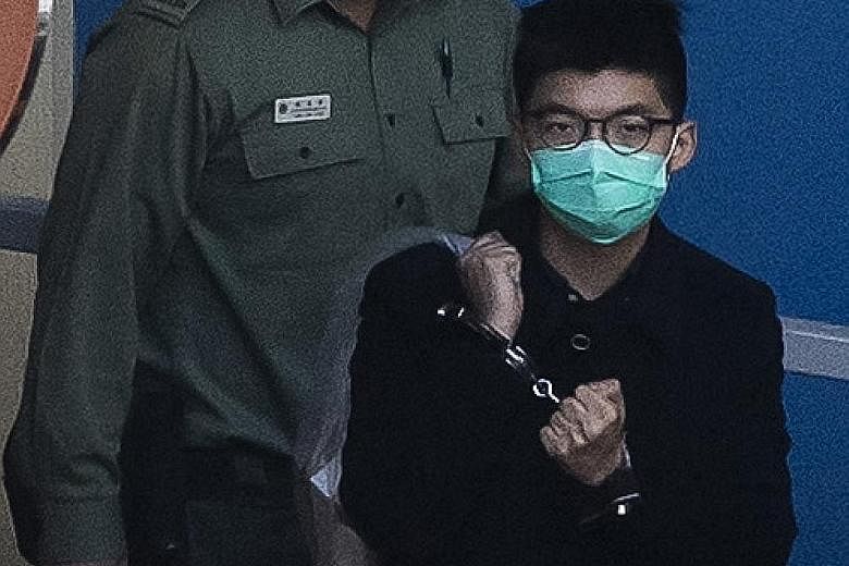 Joshua Wong, seen here earlier last month on his way to court, has been repeatedly detained for his role in organising pro-democracy rallies. PHOTO: AGENCE FRANCE-PRESSE