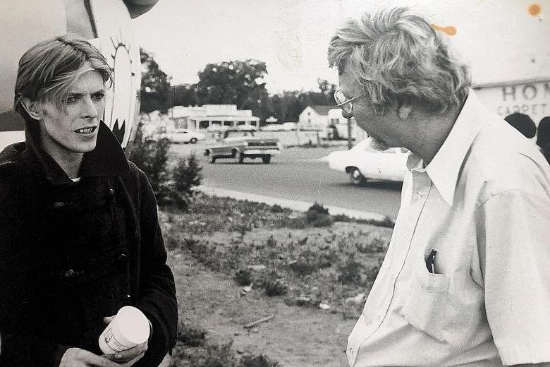 David Bowie (left) with Walter Tevis (right) on the set of The Man Who Fell To Earth (1976), which was adapted from the latter's novel of the same name.