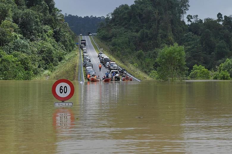 More than 48,000 people evacuated in Malaysia to escape floods  The