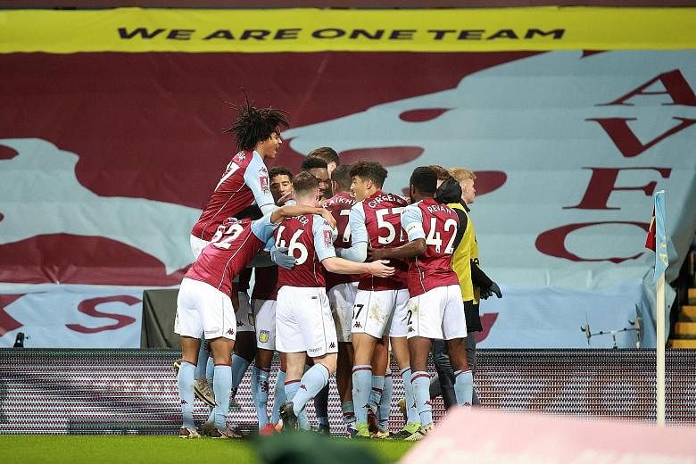 Aston Villa's makeshift team of academy players celebrate Louie Barry's goal against Liverpool in the FA Cup. It was a joy short-lived, however, as Liverpool ran out 4-1 winners.