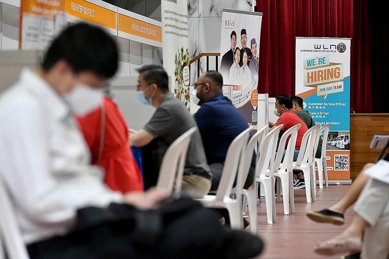 Job seekers at an SGUnited Job Interviews event at Bukit Panjang Community Club last August. As at early last month, the SGUnited Traineeships Programme has helped more than 4,700 fresh graduates find paid work.
