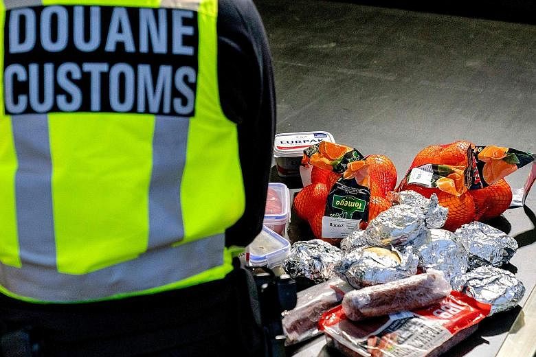 This photo taken last Wednesday shows goods laid out while a Dutch customs officer checked vehicles getting off the ferry from the United Kingdom in Hoek van Holland, as new import and export rules apply following the Brexit deal.