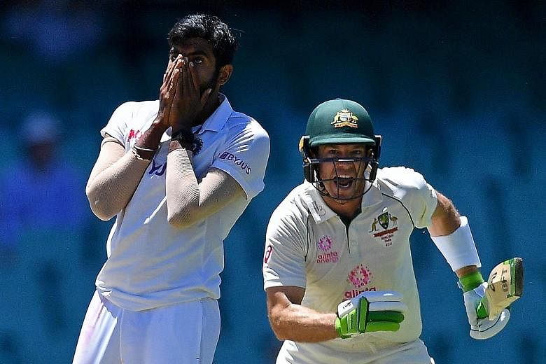 India's Jasprit Bumrah reacting after the catch of Australia's captain Tim Paine was dropped during their Test match yesterday.