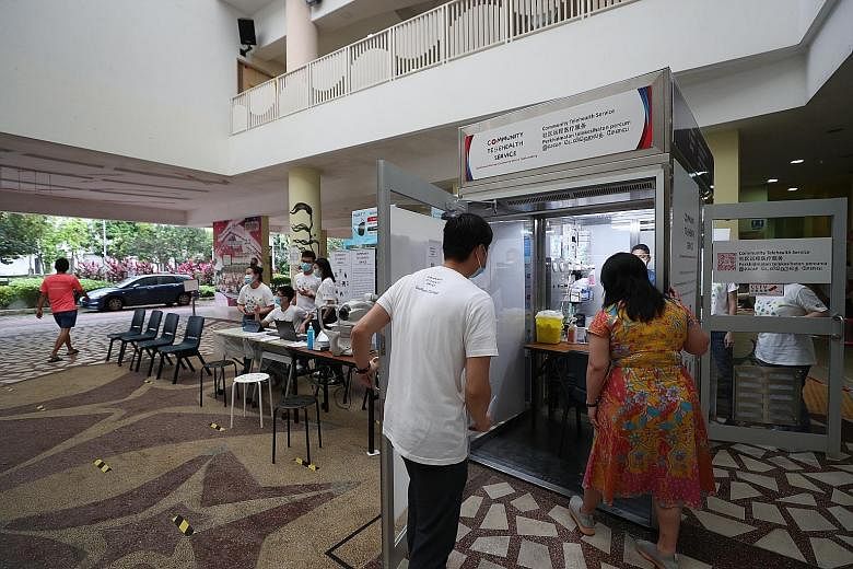 Ms Yeo Wan Ling, an MP for Pasir Ris-Punggol GRC, checking out the telemedicine booth at Punggol 21 Community Club yesterday. The booth, which will be up until Feb 28, is part of a ground-up initiative called Community Telehealth Service, which was s