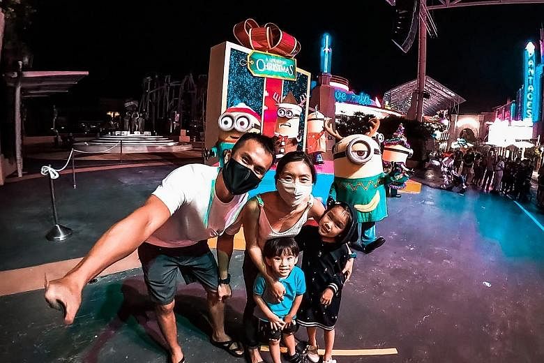 Mr Alvin Yap at Universal Studios Singapore last month with his wife Paige Chia, daughter Ashley and son Alphus. Ms Chia had used her $100 SingapoRediscovers vouchers to buy the tickets for the family, topping up the remainder in cash. PHOTO: COURTES