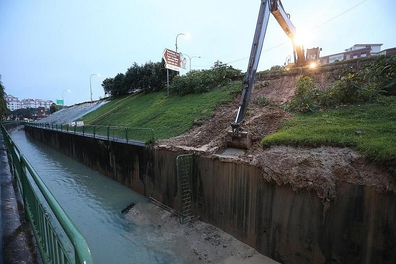 A landslip on the slope near the Tampines Expressway slip road towards Loyang Avenue on Sunday. It was the same slope where a landslip took place earlier.