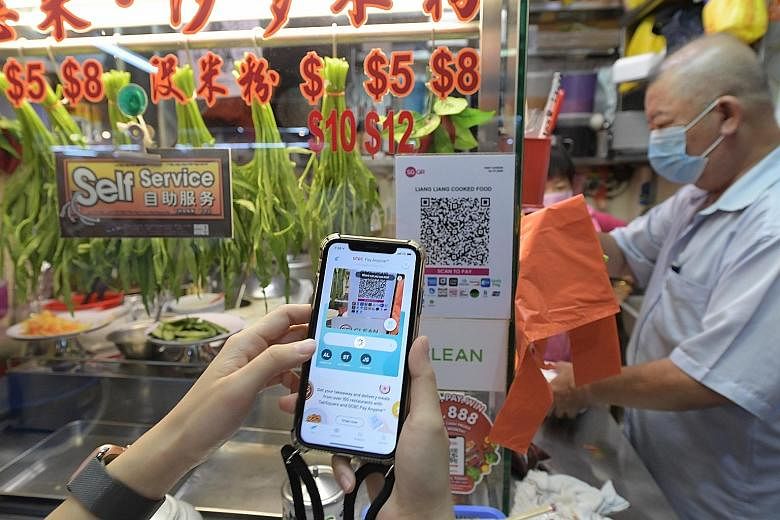 Singaporeans can send e-hongbao via PayNow. Those who bank with Citibank, DBS Bank, OCBC Bank, Standard Chartered Bank, UOB and Maybank will soon be able to add Chinese New Year greetings when they do so. ST FILE PHOTO