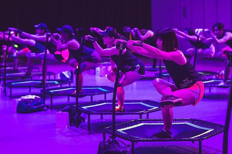 Try burpees, lunges or squats on a floating exercise mat in a pool at Skyline Aqua's FloatFit HIIT class. Students pole dancing at Slap Dance Studio. The activity incorporates dance and acrobatics. Jumping fitness involves aerobic exercises on mini t
