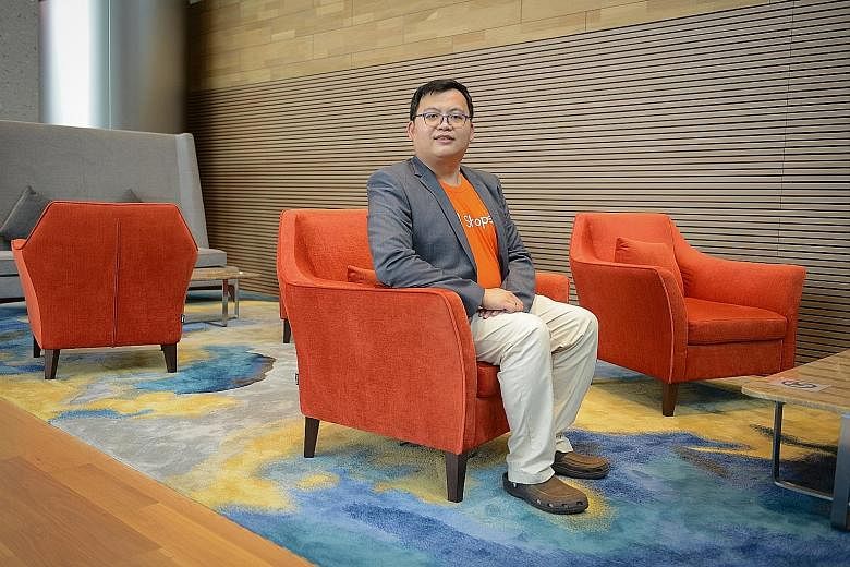 Former teacher Kenneth Chua is now five months into a new job as a systems quality assurance engineer for e-commerce platform Shopee, in a role that entails checking that the platform's application is working, troubleshooting and fixing bugs. ST PHOT