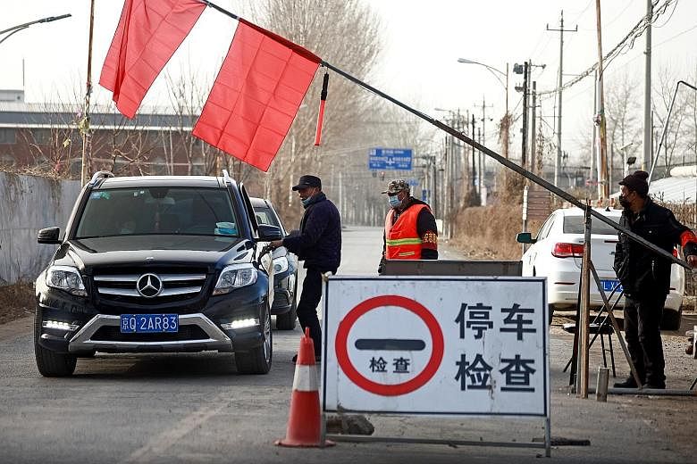 A checkpoint on the outskirts of Beijing near the provincial border with Hebei province yesterday. The number of new Covid-19 cases in mainland China reported yesterday remains a small fraction of the figure at the height of the outbreak early last y